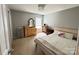 Bedroom with a light wood bed frame, dresser, a mirror, and window providing natural light at 14809 Castletown House Dr, Charlotte, NC 28273