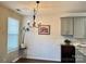 Bright dining area with a chandelier and large window provides natural light at 14809 Castletown House Dr, Charlotte, NC 28273