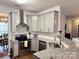 Open kitchen showcasing granite countertops, stainless steel appliances, and ample cabinet space at 14809 Castletown House Dr, Charlotte, NC 28273