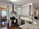 Updated kitchen featuring granite countertops, stainless steel appliances, and modern cabinets at 14809 Castletown House Dr, Charlotte, NC 28273