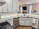 Contemporary kitchen with granite counters, stainless steel dishwasher, and modern cabinetry at 14809 Castletown House Dr, Charlotte, NC 28273