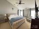 Spacious main bedroom featuring a vaulted ceiling, a king-size bed, and two windows for natural light at 14809 Castletown House Dr, Charlotte, NC 28273
