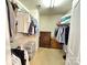 Walk-in closet with ample storage space, shelving, and hanging rods for organization at 14809 Castletown House Dr, Charlotte, NC 28273