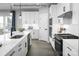 Well-appointed kitchen boasts a large island, modern appliances, white cabinets, and stylish hardware at 1809 Ab Moore Jr Dr # 3238, Indian Trail, NC 28079