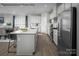 Bright kitchen featuring an island with a sink, stainless steel appliances, and a breakfast nook at 1809 Ab Moore Jr Dr # 3238, Indian Trail, NC 28079
