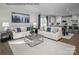 Bright and airy living room with comfortable sofas, stylish decor, and an open view to the kitchen at 1809 Ab Moore Jr Dr # 3238, Indian Trail, NC 28079