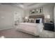 Serene bedroom featuring a king-sized bed, soft lighting, and an en-suite bathroom at 1809 Ab Moore Jr Dr # 3238, Indian Trail, NC 28079