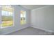 Bright bedroom with two large windows and neutral carpet; plenty of natural light at 2016 Skyhawk Dr, Lake Wylie, SC 29745