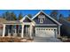 Charming home features a two-car garage, stone accents, and a covered front porch at 2016 Skyhawk Dr, Lake Wylie, SC 29745