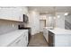 Stylish kitchen features white cabinets, quartz countertops, and stainless steel appliances at 2016 Skyhawk Dr, Lake Wylie, SC 29745