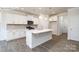 Elegant kitchen featuring white cabinets, a large island, and stainless steel appliances at 2016 Skyhawk Dr, Lake Wylie, SC 29745