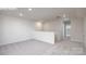 Spacious living room with neutral carpet, white walls, recessed lighting, and open floor plan at 2016 Skyhawk Dr, Lake Wylie, SC 29745