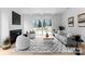 Bright living room with a modern fireplace and sliding glass doors that lead to the backyard at 2021 Mandarin Blvd, Charlotte, NC 28205