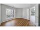 Bright bedroom features wood floors, natural light, and a neutral color palette at 2500 Cranbrook Ln # 5, Charlotte, NC 28207