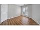 Bedroom with a large window and wood floor at 2500 Cranbrook Ln # 5, Charlotte, NC 28207