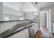 White cabinets and black countertops in the kitchen at 2500 Cranbrook Ln # 5, Charlotte, NC 28207