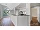 Open floor plan featuring stainless appliances and breakfast bar at 2500 Cranbrook Ln # 5, Charlotte, NC 28207