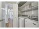 Laundry room featuring washer and dryer units, with shelving for storage at 2500 Cranbrook Ln # 5, Charlotte, NC 28207