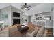 Bright living room featuring fireplace, vaulted ceiling, and breakfast bar with stainless steel appliances at 2500 Cranbrook Ln # 5, Charlotte, NC 28207