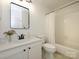 Bright bathroom featuring a tub with shower, white vanity, and a neutral color scheme at 2900 Heathstead Pl # A, Charlotte, NC 28210