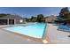 Sparkling community pool surrounded by lounge chairs and umbrellas for residents' enjoyment at 2900 Heathstead Pl # A, Charlotte, NC 28210