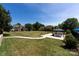 View of the community space featuring a picnic shelter, grassy area, and walking path at 2900 Heathstead Pl # A, Charlotte, NC 28210