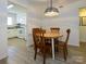 Cozy dining area with wood table, chairs, and view into the kitchen, great for gatherings at 2900 Heathstead Pl # A, Charlotte, NC 28210