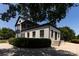 Rear exterior view highlighting the home's architecture, landscaping, and outdoor space at 2900 Heathstead Pl # A, Charlotte, NC 28210