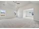 Large bedroom with vaulted ceilings, plush carpet, recessed lighting, and an adjoining sitting room at 304 Balboa St, Matthews, NC 28104
