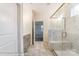 Modern bathroom featuring a tiled shower with a glass door and a gray vanity with light countertops at 3056 Bent Willow Dr # 175, Indian Trail, NC 28079