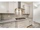 Close up of kitchen with stainless steel hood and granite countertops at 3056 Bent Willow Dr # 175, Indian Trail, NC 28079