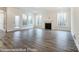 Living room with hardwood floors, fireplace, and large windows at 3056 Bent Willow Dr # 175, Indian Trail, NC 28079