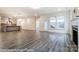 Open-concept living room with hardwood floors and ample natural light at 3056 Bent Willow Dr # 175, Indian Trail, NC 28079