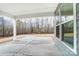 This covered patio provides a serene outdoor living space with a view of the fenced backyard at 3056 Bent Willow Dr # 175, Indian Trail, NC 28079