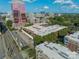 An aerial view displays low rise buildings amidst a cityscape, with greenery at 310 Arlington Ave # Multiple, Charlotte, NC 28203