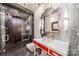 A modern bathroom featuring mosaic tile work in the shower and a stylish red vanity at 310 Arlington Ave # Multiple, Charlotte, NC 28203