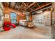 Comfortable bedroom featuring exposed brick, wood ceilings and large windows for great natural light at 310 Arlington Ave # Multiple, Charlotte, NC 28203