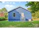Rear exterior view of the home highlighting the yard space, blue siding, and back entrance at 332 Mountain View St, Gastonia, NC 28052
