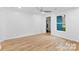 Bright bedroom with ceiling fan, wood-look floors, and neutral wall paint at 332 Mountain View St, Gastonia, NC 28052