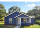 Charming single-story home featuring blue siding, a welcoming front porch, and a well-manicured lawn at 332 Mountain View St, Gastonia, NC 28052