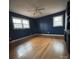 A large bedroom with hardwood floors, natural light, and a ceiling fan at 3367 Marshall Wolfe Rd, Kings Mountain, NC 28086