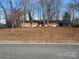 Charming brick ranch home featuring a covered carport and mature trees at 3367 Marshall Wolfe Rd, Kings Mountain, NC 28086
