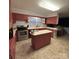 A kitchen with a center island, stainless steel oven, and updated appliances at 3367 Marshall Wolfe Rd, Kings Mountain, NC 28086