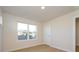 Bright bedroom with a large window, door and light walls, creating a fresh, inviting, and relaxing space at 3924 Craig Ave, Charlotte, NC 28211