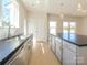 Bright kitchen featuring stainless steel appliances, stone countertops, and a large island at 3924 Craig Ave, Charlotte, NC 28211