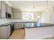 Spacious kitchen features stone countertops, white subway tile backsplash, stainless steel appliances, and pendant lighting at 3924 Craig Ave, Charlotte, NC 28211