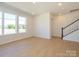 Spacious living area with staircase and natural light at 3924 Craig Ave, Charlotte, NC 28211