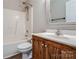 Bathroom features a single vanity, toilet and shower-tub combo with modern fixtures at 406 Llewellyn St, Belmont, NC 28012