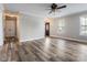 Inviting living room featuring stylish wood floors, neutral paint, and plenty of natural light from bright windows at 406 Llewellyn St, Belmont, NC 28012
