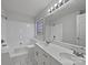 Bright bathroom with double sinks, large mirror, soaking tub, and natural light at 414 Fox Fire Run, Gastonia, NC 28052